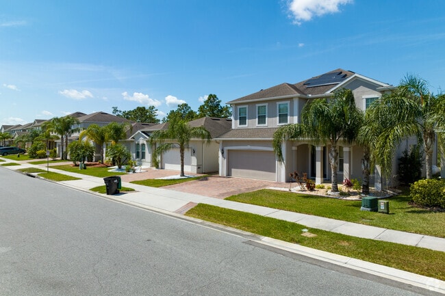 A row of traditional style homes in the highly sought The Pointe at Hunters Creek Community.
