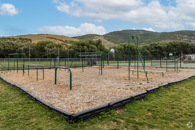 A large playground is padded with wood chips at South Summit Middle School.