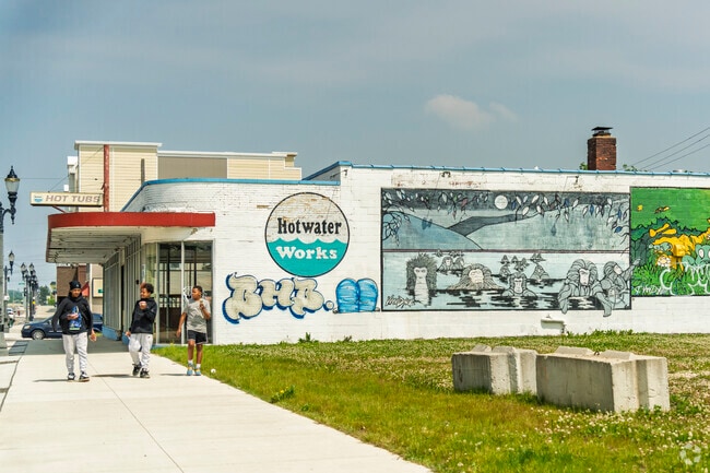 Foster locals enjoy their ice cream from Quality Dairy Store on a warm day.