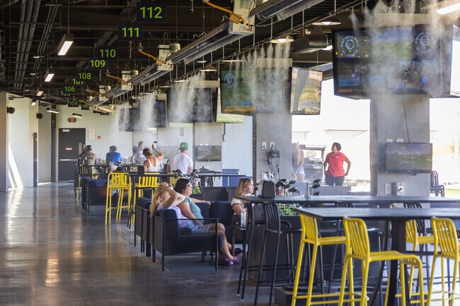 Groups of friends and families visit BigShots Golf for a great time.