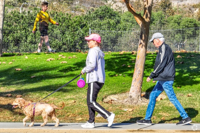 Take you dog for a walk on the paved paths of San Clemente Beach Trail with easy crossing past the railroad tracks and further on to the Beach.