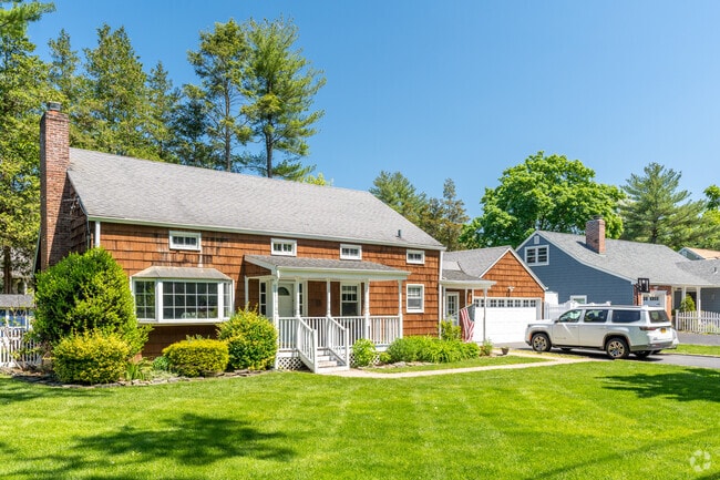 Colonial Revival home with detached garages are common in Sea Cliff.