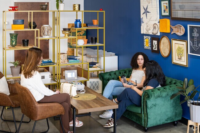 Friends sip boba drinks at Boba Lova, a cozy spot in Knightsville.