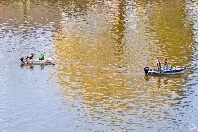 Fishermen drift across the glimmering Delaware River, a living reminder that in Lambertville, the rhythms of nature and community flow effortlessly together.