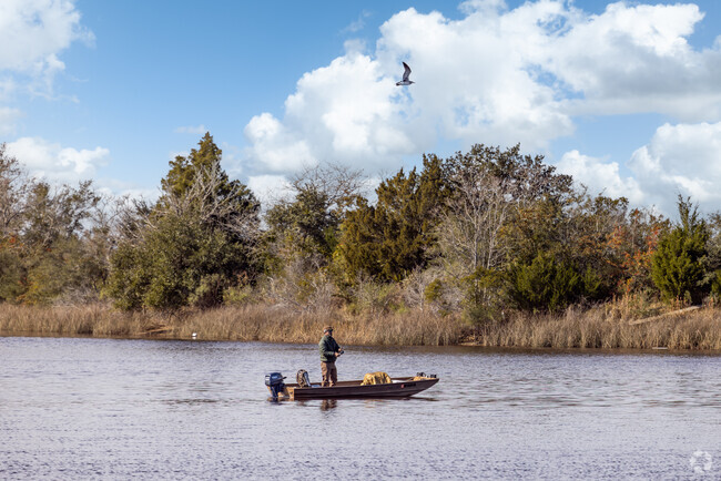 A local fisherman enjoys the afternoon fishing the waters near Diamondhead.