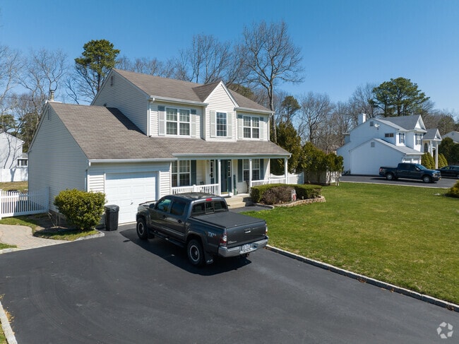 Two grand colonial homes sitting on spacious lots In Middle Island.