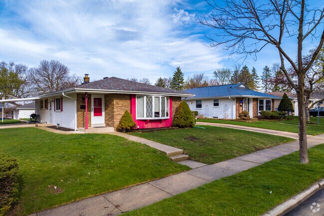 Ranch homes and sidewalks in the Alcott neighborhood.