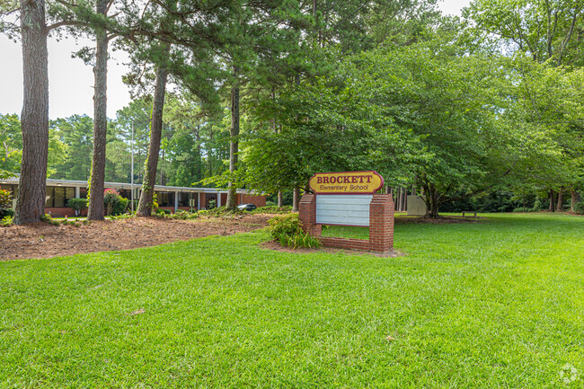 alternate view of the front of the school with sign in front