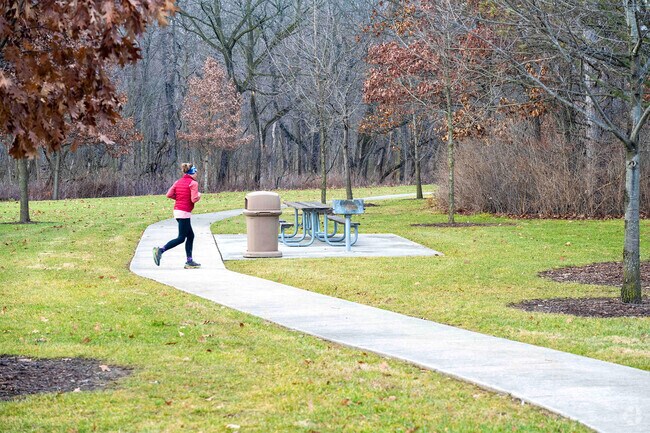 A resident jogs at the Messenger Woods Nature Preserve in Homer Glen, IL.