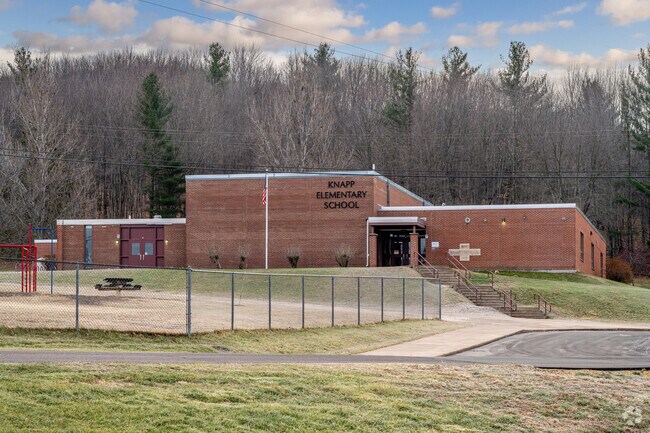 Knapp Elementary School is nestled on the edge of rolling woods.