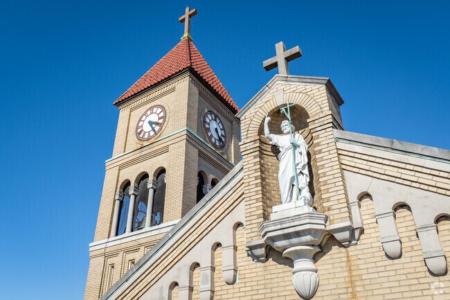 The St. John statue looks over the residents of Church at St. John Church.