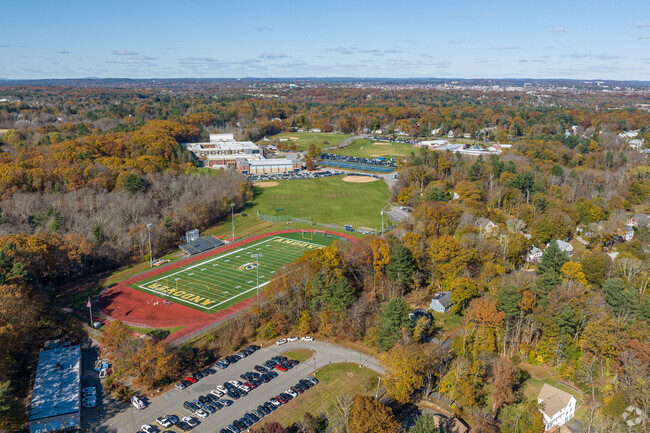 The back side of the Andover High School with it's track and field in Andover, MA.