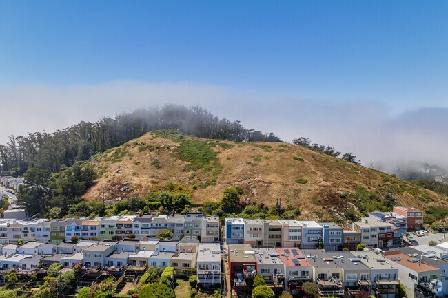 The four layers of Mt. Davidson are homes, open space, fog, and sky.
