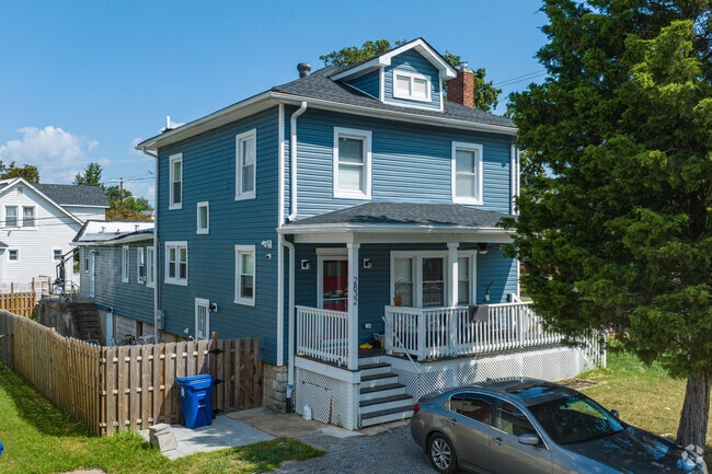 A colorful classic Four Square home located on Christopher Ave in Christopher.