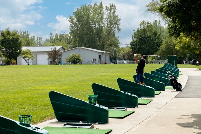 The driving range at Bliss Creek attracts golfers of all ages around Blackberry Countryside.
