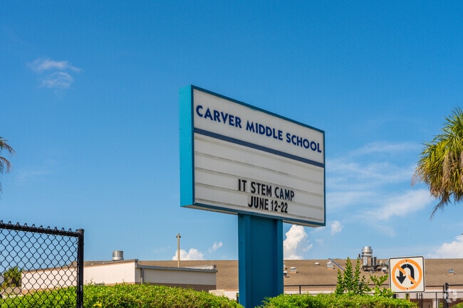 Carver Community Middle School and announcement board at entrance of school.
