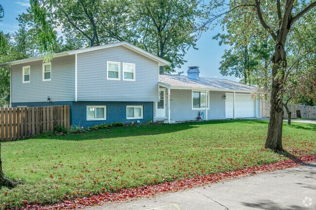This three-story Colonial Park home features a fenced backyard for your pets.
