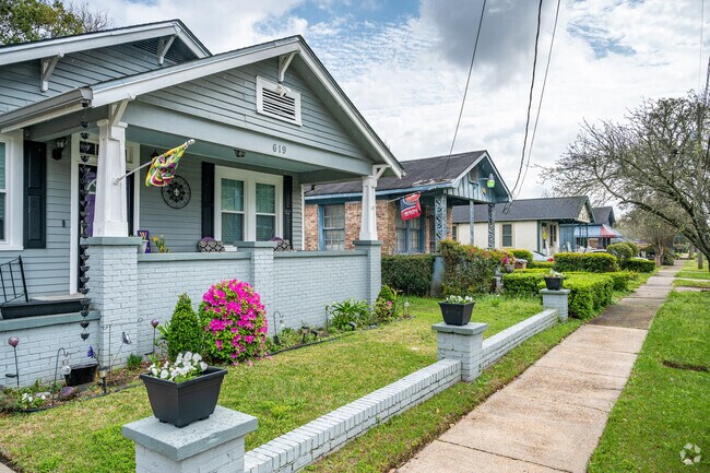 A row of small one story houses in Texas Street have small front porches.