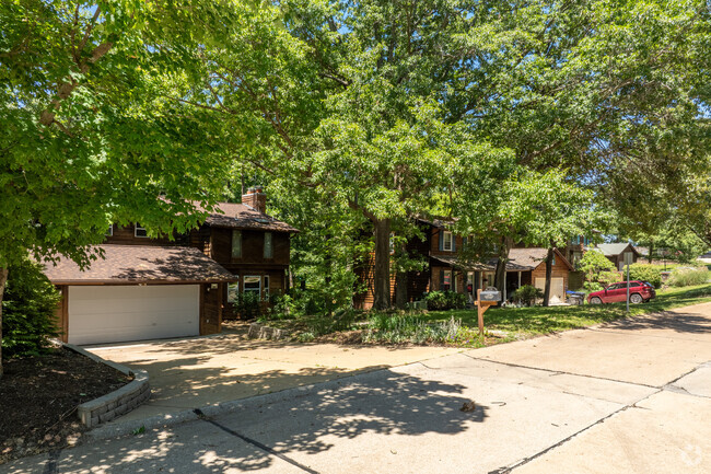 Many homes in Twin Oaks sit beneath a large canopy of trees.