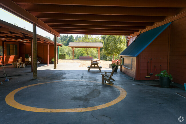 Main entrance with some picnic benches at West Hills Montessori School.