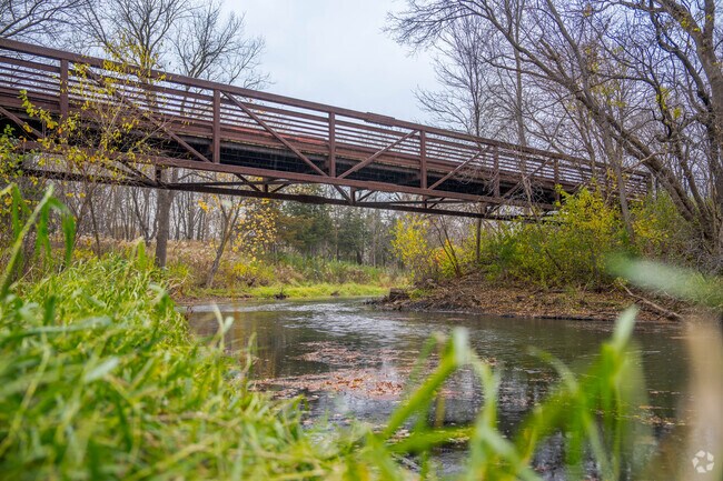 A bridge from the Cedar Lake Trail connects residents to the shopping district nearby.