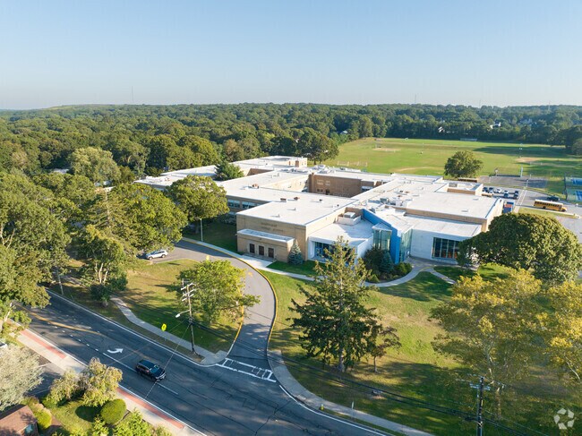 NID507906 Happague Middle School sits right next to Happague High School in a busy neighborhood.