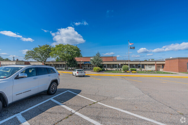 The welcome sign and front entrance of John F Kennedy Intermediate School.