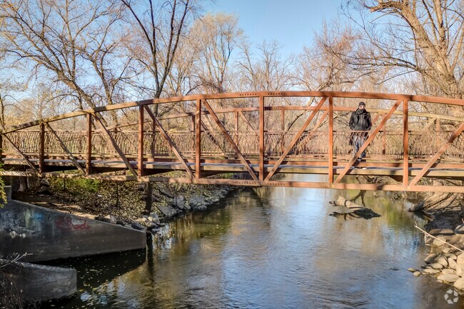 River North locals can take in the view of the Grand River from a walking bridge.