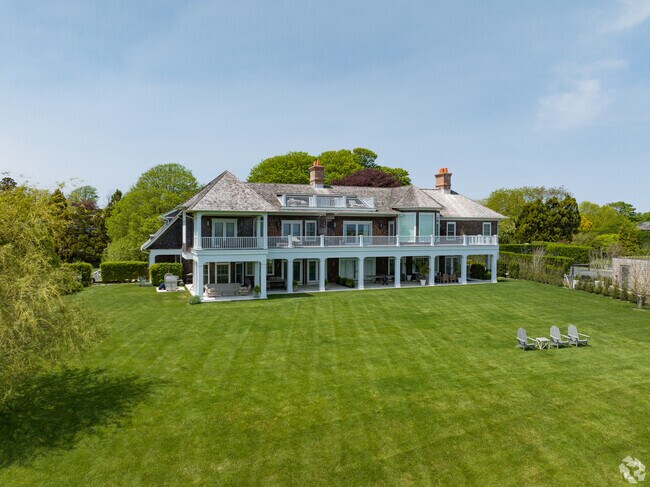 Pristine contemporary beach houses in East Hampton have large backyards.
