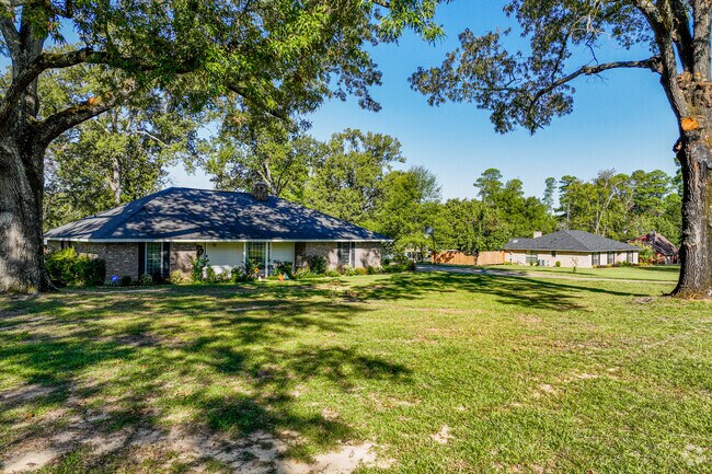 Many of the homes in Greenwood have large front yards.