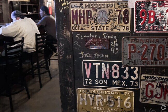 See the walls of license plates inside Li'l Abner's of Saguaro Bloom.