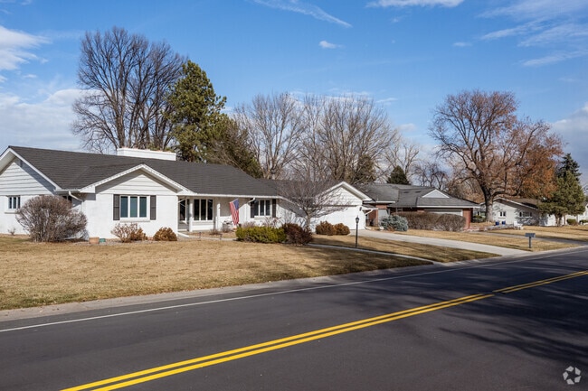 A row of traditional and modern renovated ranch homes in Columbine Valley, Colorado.