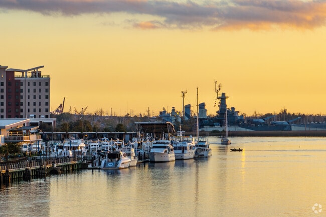 The USS North Carolina battleship rests in view of Wilmington along the Cape Fear River.