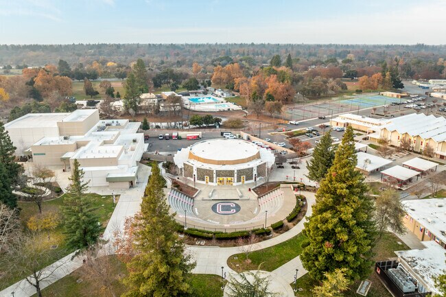 Cordova High School has a lush campus with tall trees.