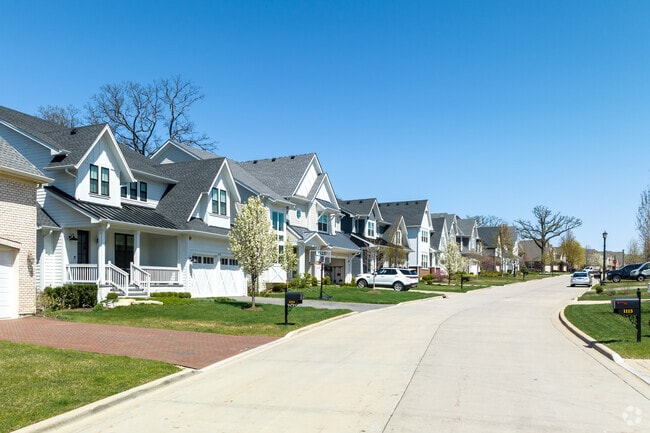 Modern traditional homes neatly seating along a slightly curving road in Ridgewood.
