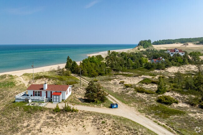 Farther south in Crystal Downs Country Club can be found sandy lake homes along Lake Michigan.
