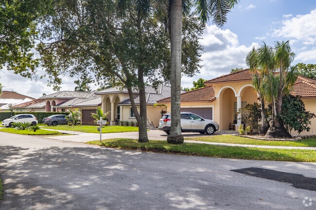 Live under beautiful shaded trees at The Hammocks, FL.