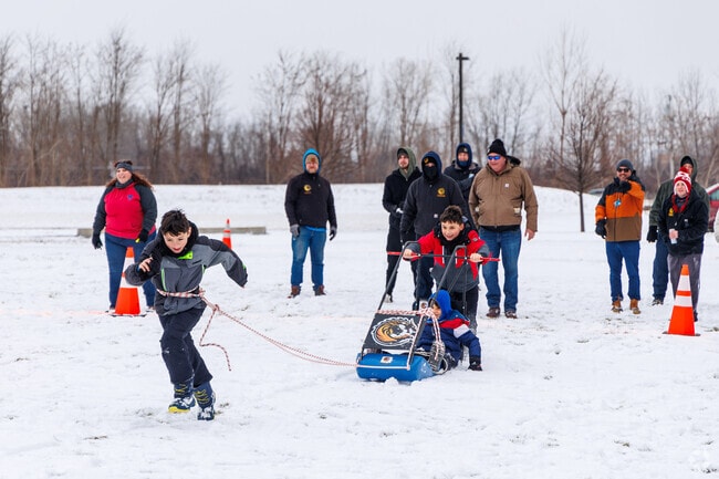 Kids participate in the human dog sled games at Winterfest 2024 near Lyncourt.