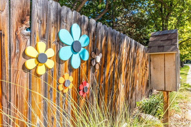 Mission Hills residents add vibrant flowers to their fences, creating colorful curb appeal.