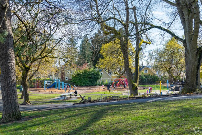 Irvington Park's playground and tree covered walking path in the Irvington neighborhood.