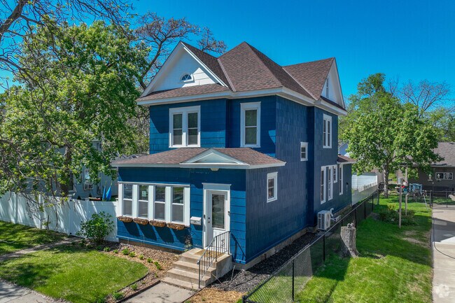Elegant Queen Anne-style homes beautify the streets of Saint John Cantius.