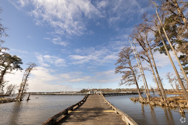 Stroll along the peaceful marina walkways at Albemarle Plantation, offering beautiful waterfront views.