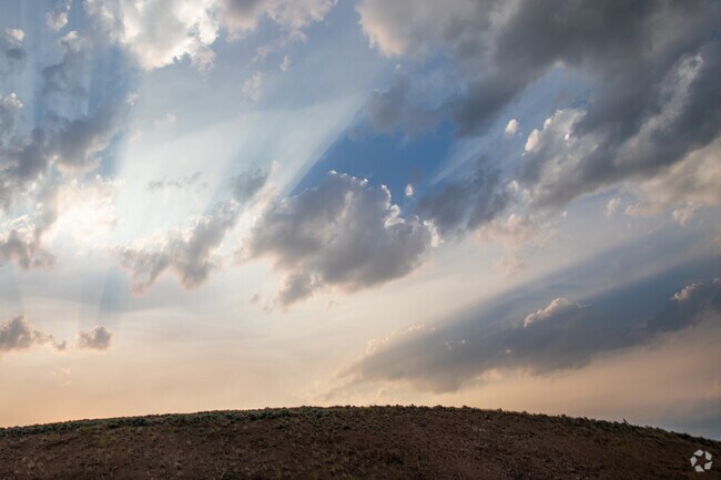 Rays of light sweep across the South Hills landscape in Helena.