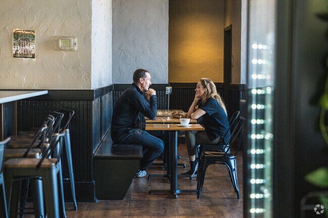 A cozy corner at Cure Coffee Shop, where the aroma of freshly brewed coffee fills the air.
