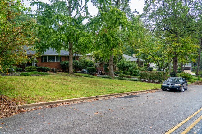 A row of homes in Bradford-Ridgewood are spaced apart with spacious yard and green surroundings.