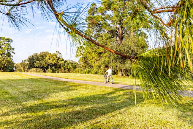 Go for a morning bike ride at Pine Island Ridge Park, near Playland Village.