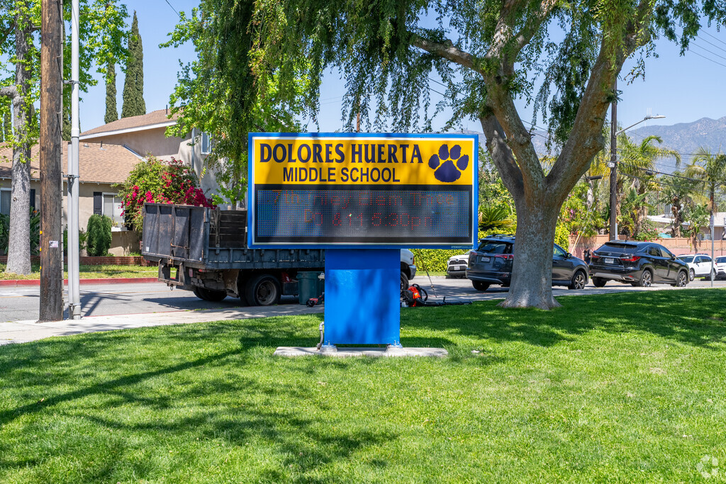 The Dolores Huerta Middle School sign serves not only as a marker but also as a celebration of the school's mission to empower every student to succeed.