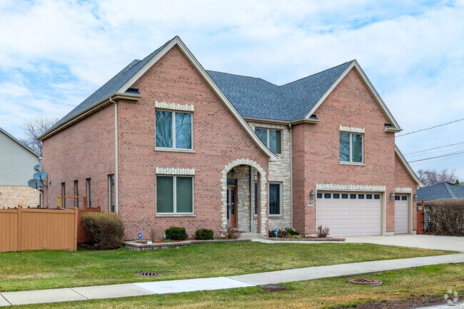 Contemporary homes with brick facades and arched entryways can be found in Des Plaines.