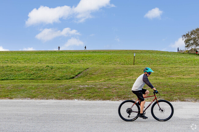 Lone Pines local bikes through the neighborhood, embracing the community.
