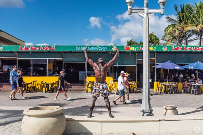 People are enjoying their workout at the boardwalk of Hollywood Beach.